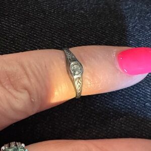 Sterling Silver baby ring with diamond chip.
